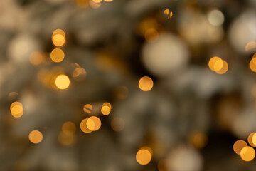 Abstract gold bokeh with Christmas tree, new year theme background