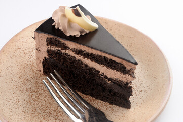 Chocolate pastry with chocolate fudge topping and frosting