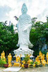 Statue of Mary with monks. A Buddhist temple complex near Nha Trang.