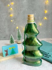 Bath foam in the shape of a Christmas tree, soap and a towel. Decorative design.
