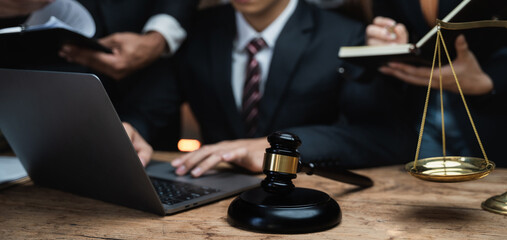 Business people and lawyers discussing contract papers sitting in the table at office in the...