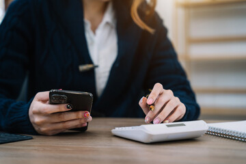 Business women and financial concepts about office work. Analysts discuss business with a calculator as a tool.