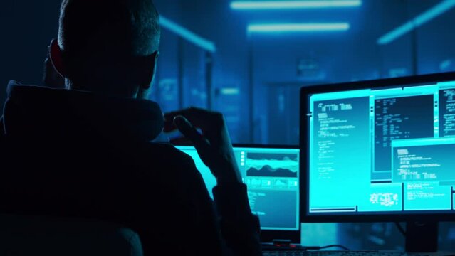 Computer Hacker in Hoodie. Obscured Dark Face. Hacker Attack, Virus Infected Software, Dark Web and Cyber Security concept