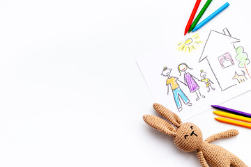 Childrens drawing of happy family with colored pencils