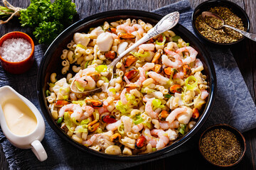 macaroni salad with shrimps, mussels, fish, leek