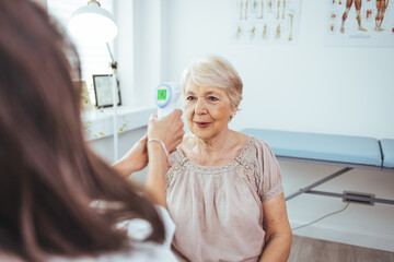 Temperature screening. Fevers measure forehead by infrared for patient in clinic during coronavirus...