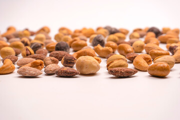  A group of almonds, pistachios, walnuts, macadamia, cashews.