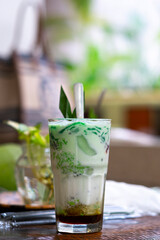 Es cendol is a traditional Indonesian iced dessert. Popular during fasting in Ramadan. A refreshing cold drink when drunk in the day and evening. Vertical image orientation.