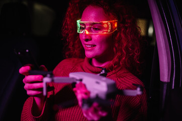 Woman with glasses of virtual reality and using drone. Future technology concept.