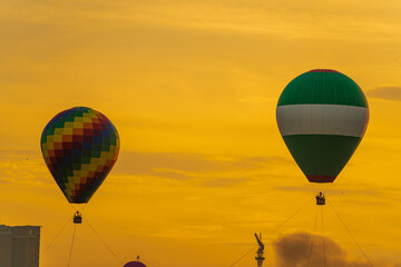 Colorful hot air balloons flying over mountain at Disctrict 2, Ho Chi Minh city in Festival. Beautiful morning, vibrant dawn color