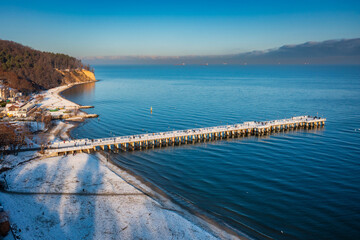 Beautiful landscape with wooden pier in Gdynia Orlowo in winter scenery, Poland