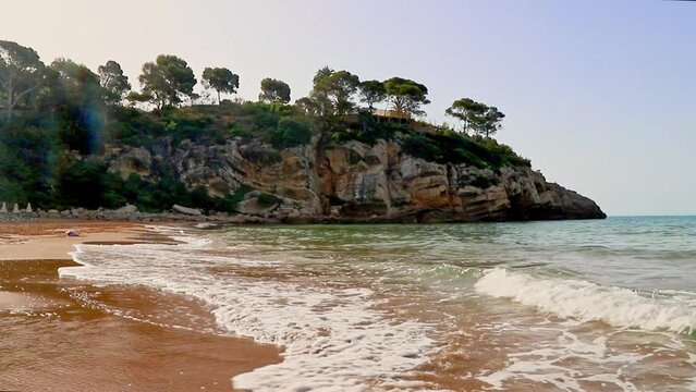 Beautiful landscape of rock formations on the La Pineda beach in Salou Spain.