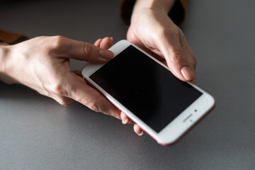 hands holding pressing smartphone buttons