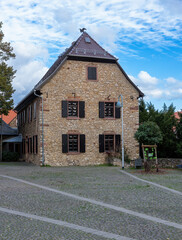 old brick house with wooden shutters in Germany