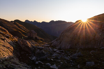 Super colorful morning in the Alpine hut with sun rays