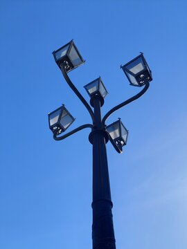 Close up of lamppost isolated on blue sky background. Set of vintage street lamps isolated 