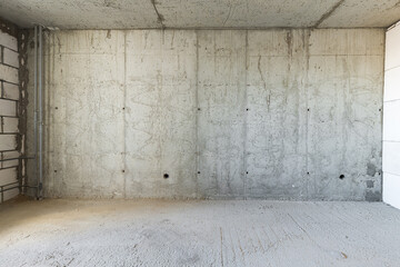 Empty concrete commercial space without finishing with partitions