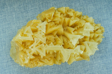 Close-up of naturally occurring rare yellow crystalline ore