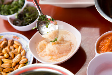 Preparing a delicious Peruvian sea bass ceviche in the fishing port of Chorríos in Lima.