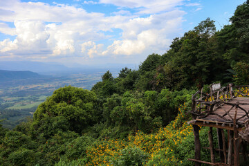 Fototapeta na wymiar Mountain view on wooden balcony on the mountain.
