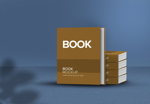 Book mockup layout on blue grunge effect background.