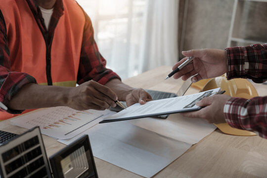 Professional engineering solar planning blueprint with team, Wind turbine and Solar Energy Electrical Engineer concept.