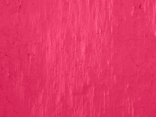 Painted wall. Abstract toned background in Viva Magenta. Trendy color of 2023. Background with copy space.