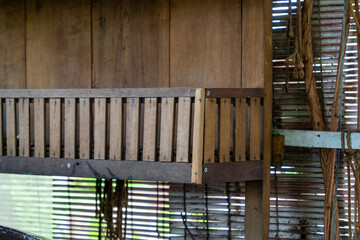 close up of wooden chairs on the terrace suitable for furniture ideas. selective focus wooden chair garden grasshopper background