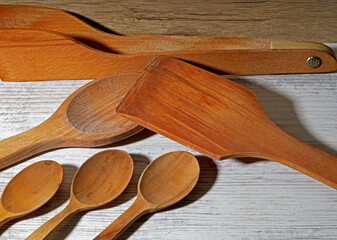 wooden kitchen utensils on wooden background