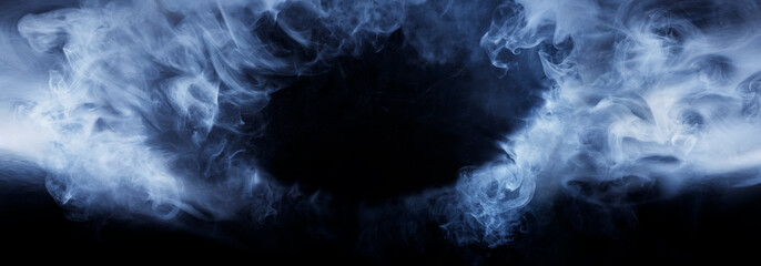 Panoramic view of the abstract fog. Cloudiness, mist or smog moves on black background. Beautiful swirling smoke. Mockup for your logo. Wide angle horizontal wallpaper or web banner.