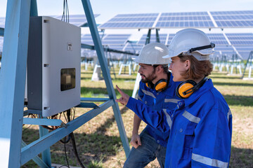 Maintenance engineer at solar farm trouble shooting looking at inverter control panel malfunction