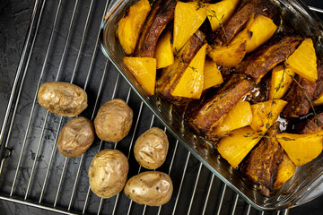 Baked pumpkin with pork ribs and potatoes, top view