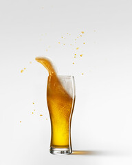 Glass with light, foamy beer isolated over grey background. Lager beer degustation. Concept of alcohol, oktoberfest, drinks