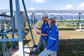 Maintenance engineer at solar farm trouble shooting looking at inverter control panel malfunction