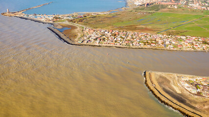Aerial view of the Tiber River estuary in the Tyrrhenian Sea. It is located in the municipality of...