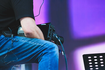 The operator with a video camera shoots a concert. Shooting video at the event.