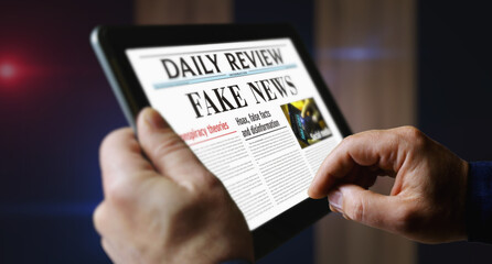 Fake news and disinformation newspaper on mobile tablet screen