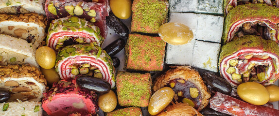 Mix of various pieces of traditional turkish delight. Oriental sweets. Delicious and tasty background. Close-up detail view - obrazy, fototapety, plakaty