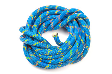 durable colored rope for climbing equipment on a white background. coil of braided cable. item for...