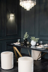 Christmas interior, fir branches in vases on the table