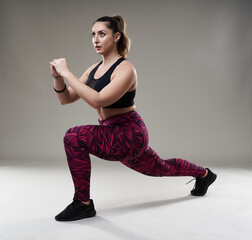Confident plus size woman stretching before workout