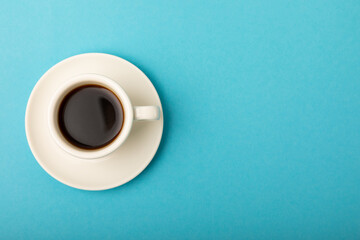 Cup of coffee on a blue background. Espresso. View from above. Space for copy. MOCAP. Breakfast. good morning.