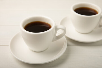 Cup of coffee on white texture wood. Espresso. View from above. Space for copy. MOCAP. Breakfast. good morning.