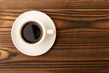 Cup of coffee on brown texture wood. Espresso. View from above. Space for copy. MOCAP. Breakfast. good morning.