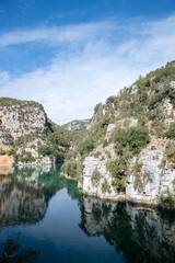 Fototapeta na wymiar Scenic view of Verdon river surrounded by medium cliffs with copy space, Lower Verdon Gorges, France