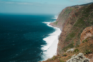 Dramatic cliff faces at the edge of the sea on the island of Madeira
