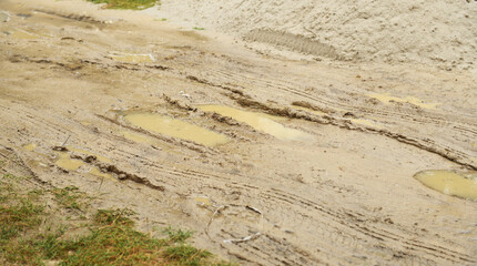 Mud and puddle at dirt road. Deep, impenetrable mud. Danger of getting stuck.