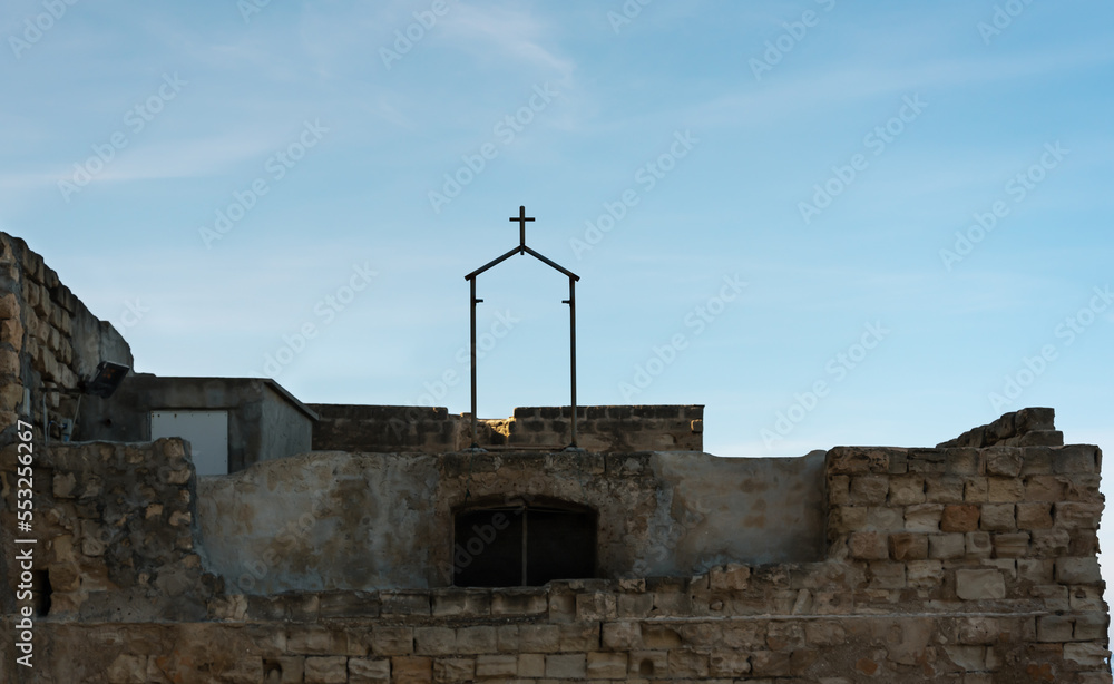 Wall mural view of the cross on a coast.