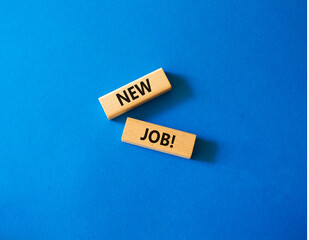 New job symbol. Wooden blocks with words New job. Beautiful blue background. Business and New job concept. Copy space.