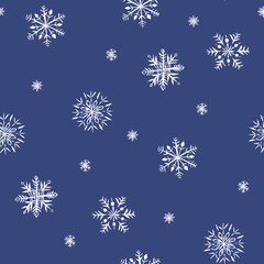 Winter seamless pattern of snowflakes. White snowflakes on deep blue background.